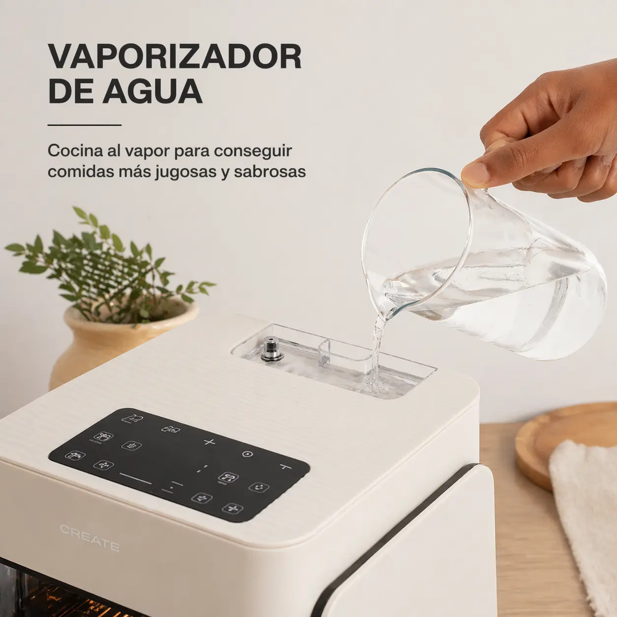 freidora de aire con vapor cocinando verduras en recipiente de cristal visible